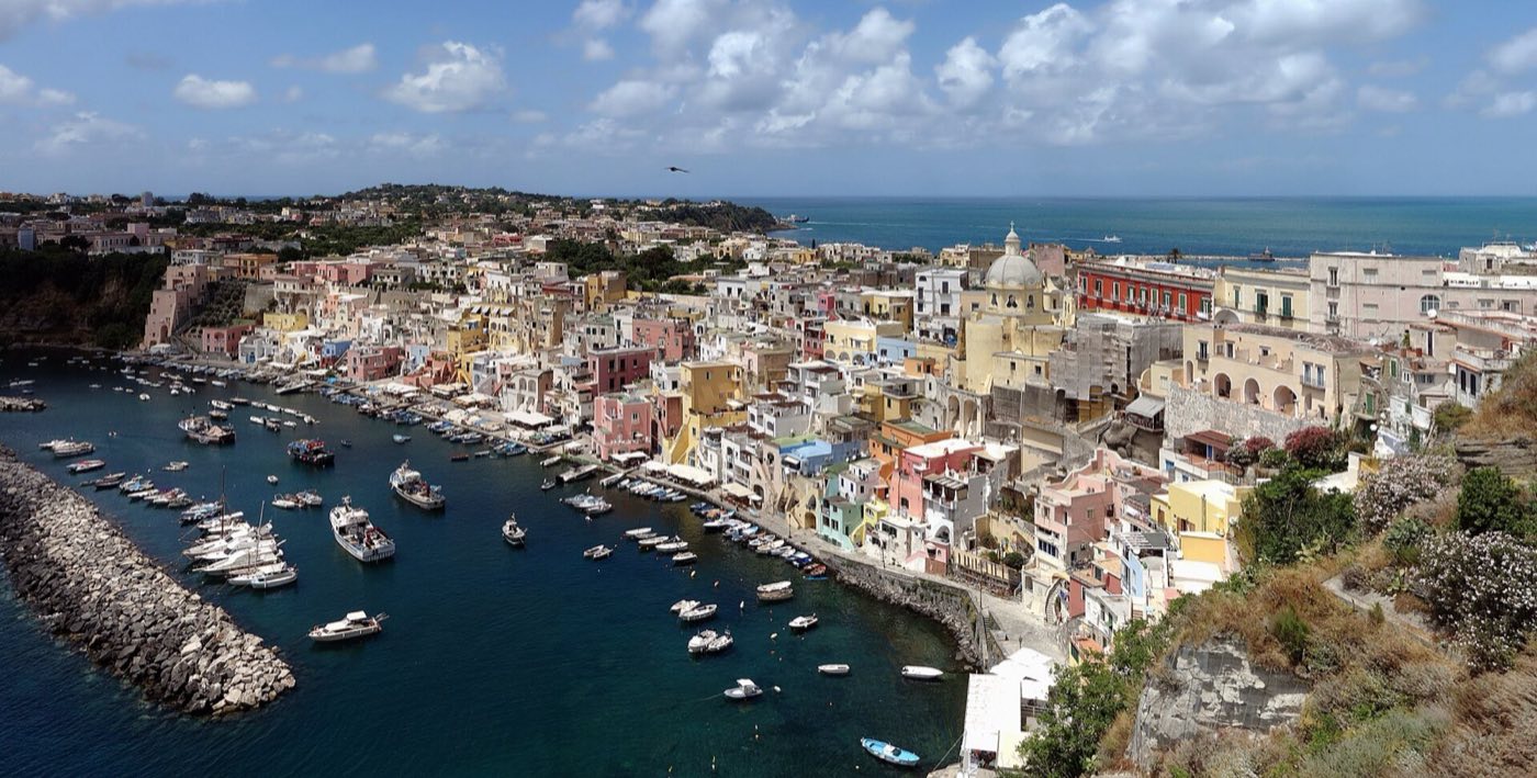Pastel houses of Marina Corricella on Procida seen from the water