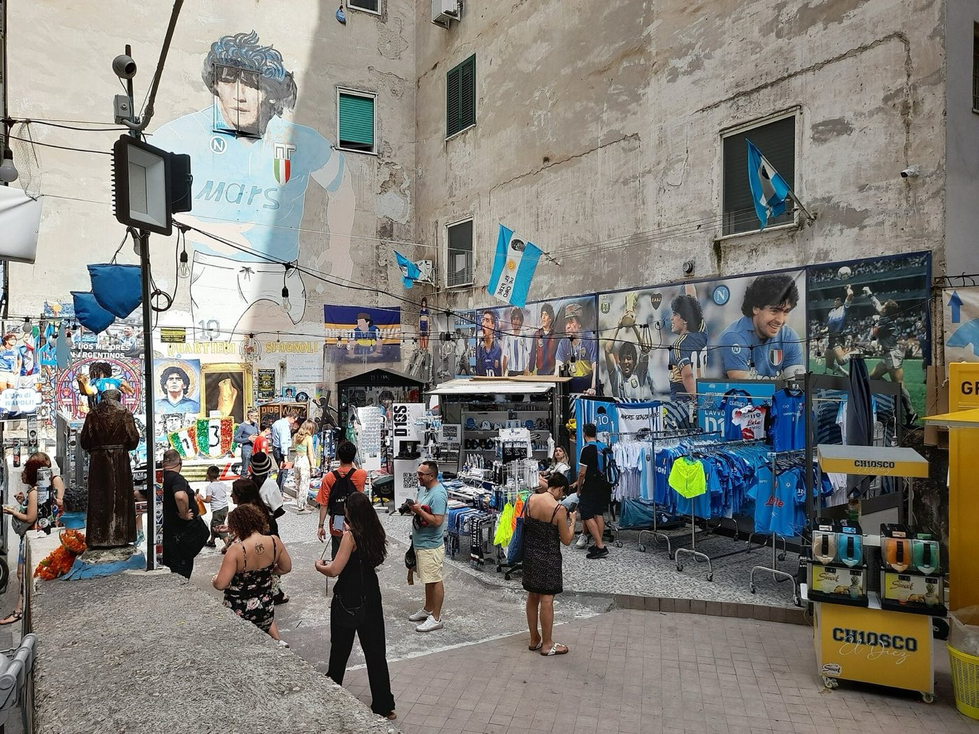 Narrow alley in the Spanish Quarter of Naples with laundry hanging between the buildings